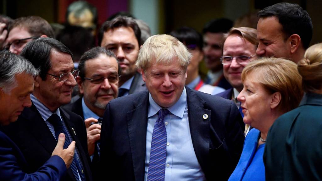 Boris Johnson surrounded by EU leaders