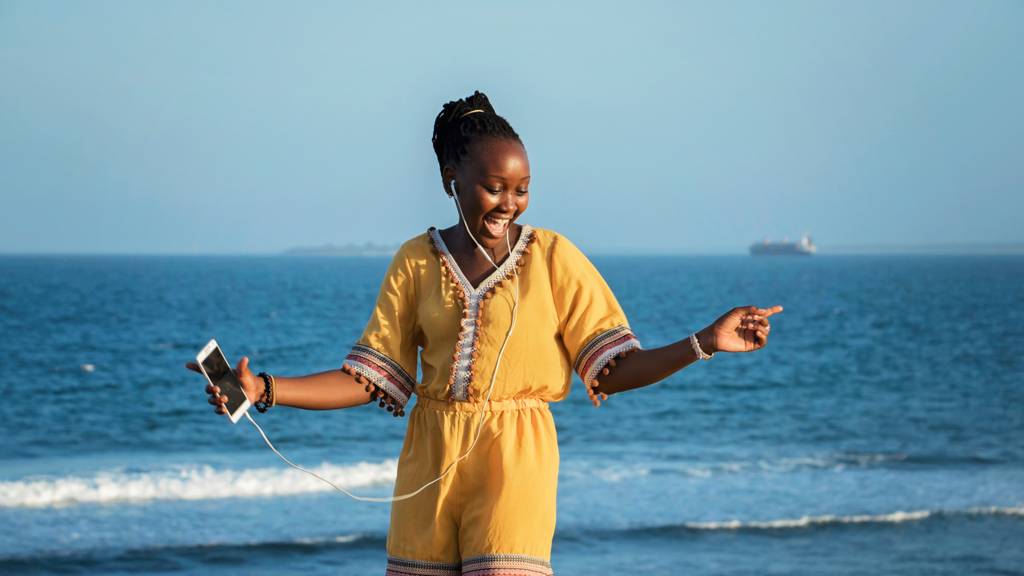 A woman listening to music in Tanzania
