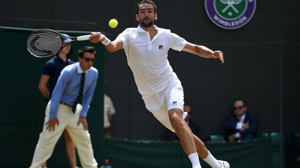 Federer outclasses Raonic to reach semi-finals