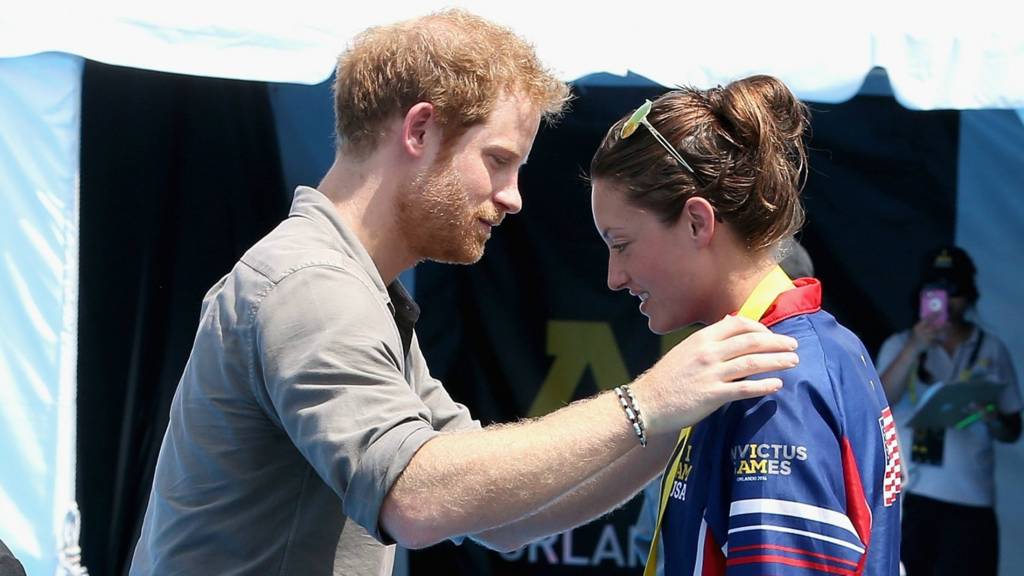 Prince Harry presents medal to Sgt Elizabeth Marks