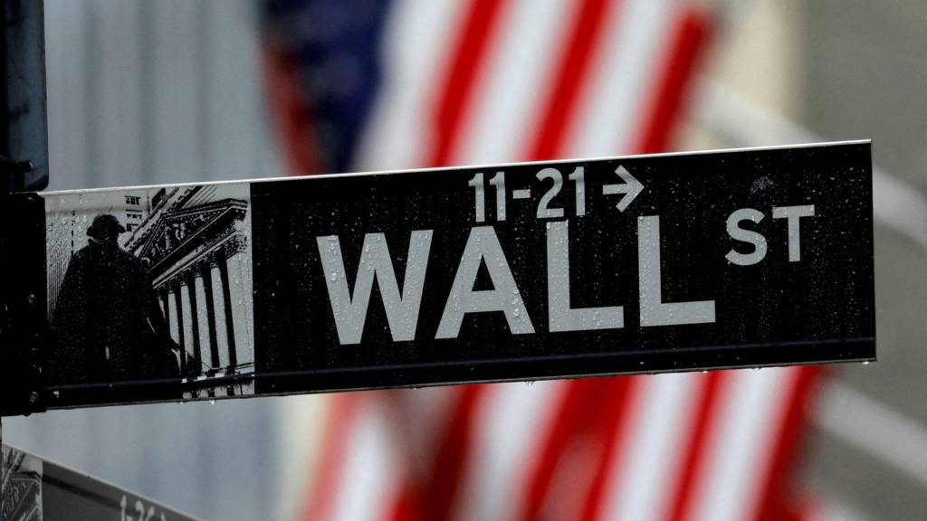 A sign for Wall Street outside the New York Stock Exchange in Manhattan, New York City