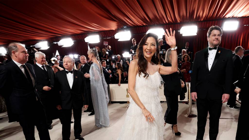 Michelle Yeoh pose on the champagne-colored red carpet during the Oscars arrivals at the 95th Academy Awards in Hollywood, Los Angeles, California, U.S., March 12, 2023