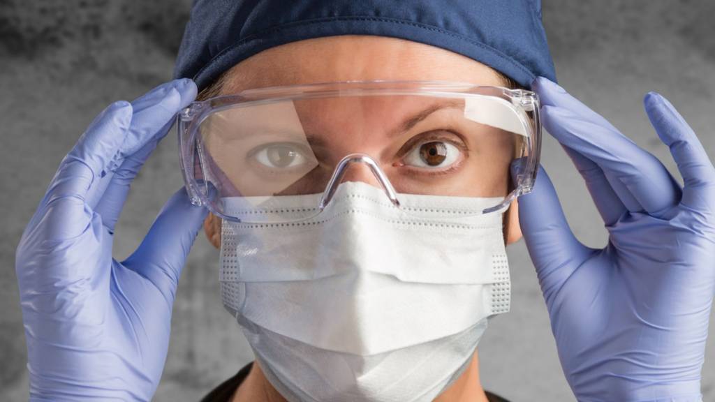 Medical professional in mask and gloves