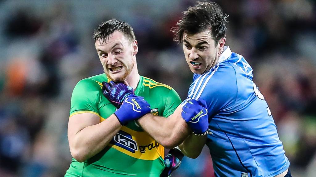 Donegal's Leo McLoone battles with Dublin's Michael Darragh Macauley