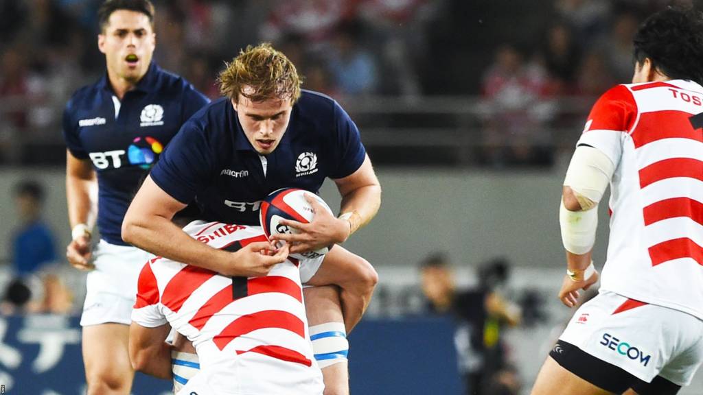 Scotland lock Jonny Gray is tackled by Japan's Shokei Kin