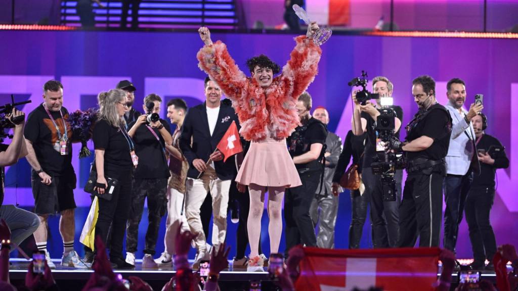 Switzerland's Nemo holds the crystal trophy after being crowned the winner of Eurovision 2024