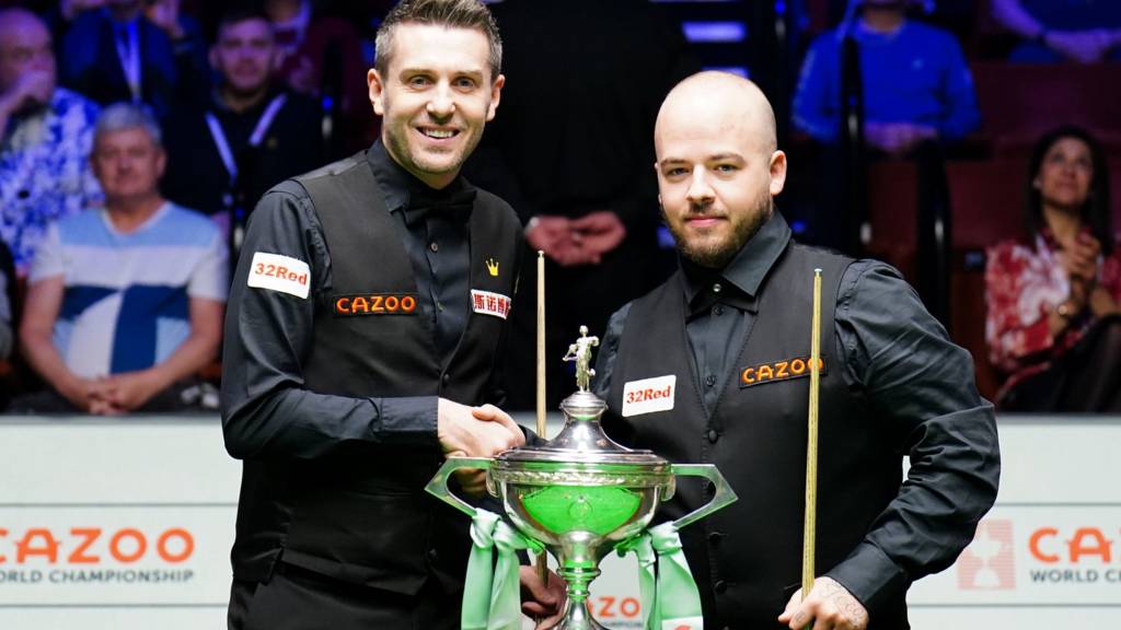 Mark Selby and Luca Brecel with the World Championship trophy