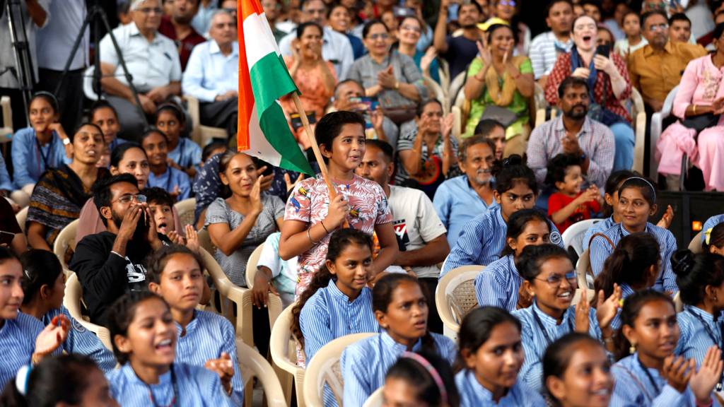 People react as they watch a live stream of Chandrayaan-3 spacecraft's landing on the moon, at an auditorium of Gujarat Science City in Ahmedabad, India, on 23 August 2023