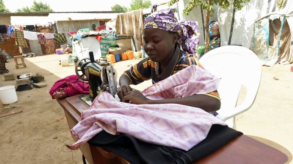 Woman using a sewing machine in northern Nigeria