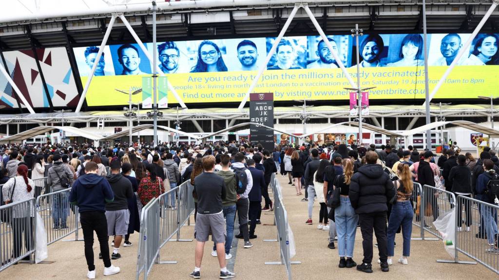 Queues at a temporary vaccination centre at West Ham's London Stadium