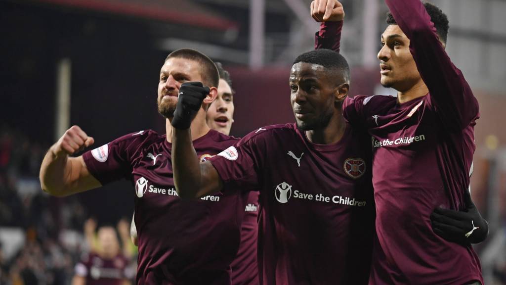 Hearts Bjorn Johnsen (r) celebrates his goal with Arnaud Djoum (c)