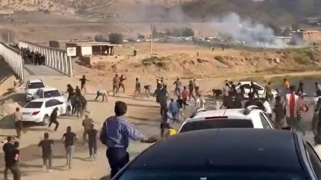 Social media footage shows clashes between security forces and protesters in Iran