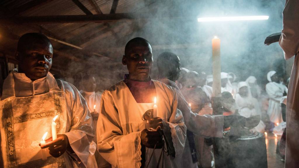 Members of a church in Kenya holding candles