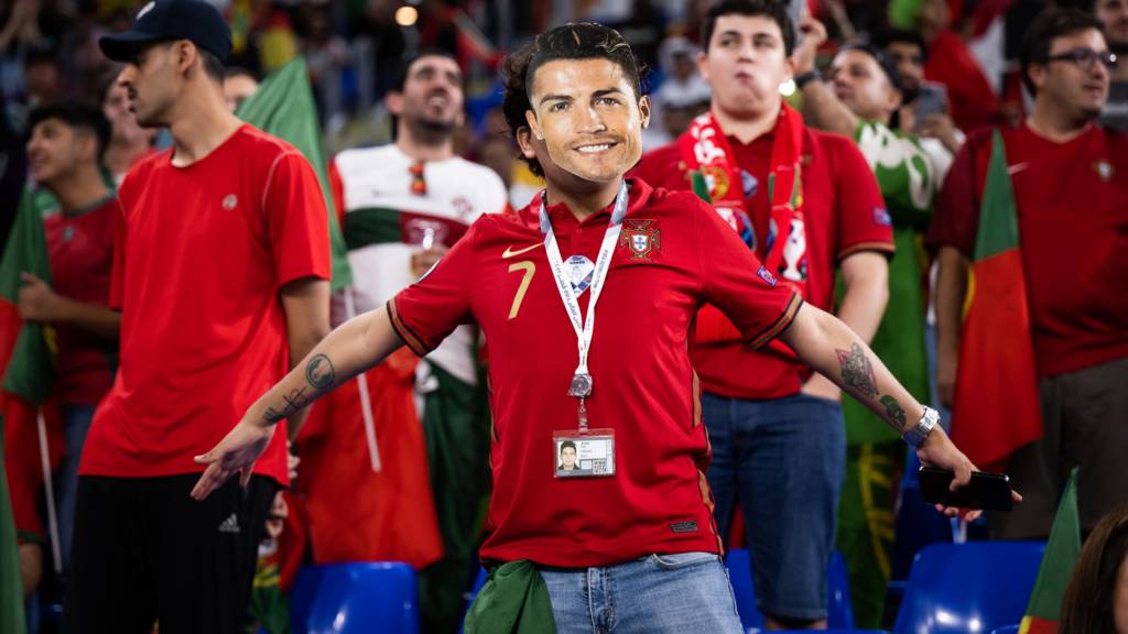 A fan with a Cristiano Ronaldo mask at the FIFA World Cup Qatar 2022