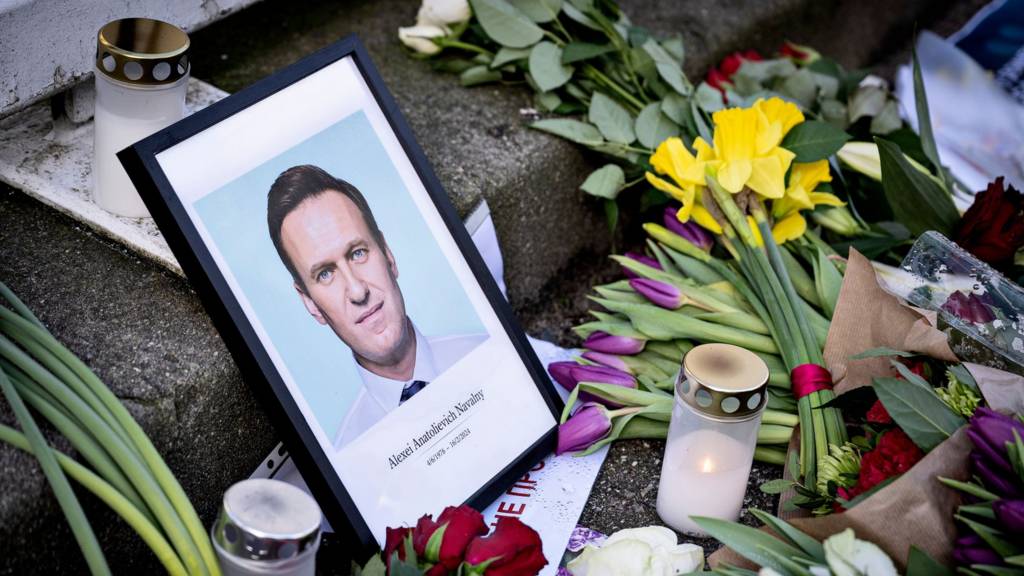 A picture of Alexei Navalny among floral tributes