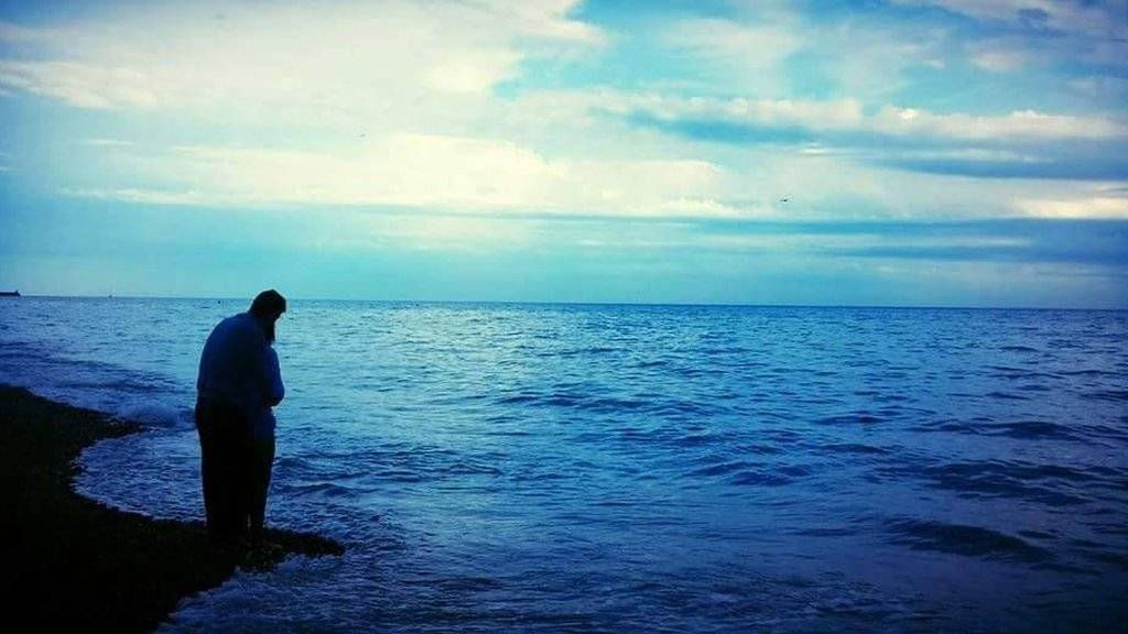 A couple looking out to sea