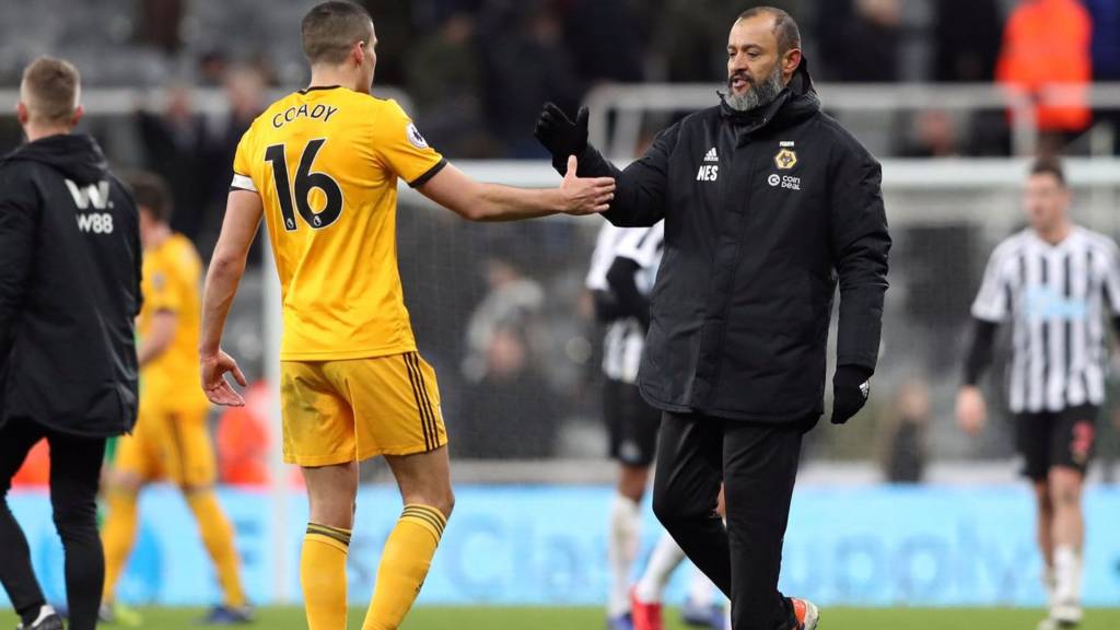 Wolverhampton Wanderers manager Nuno Espirito Santo shakes hands with Conor Coady