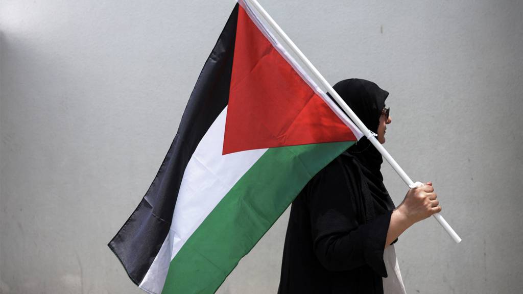 Woman with Palestinian flag