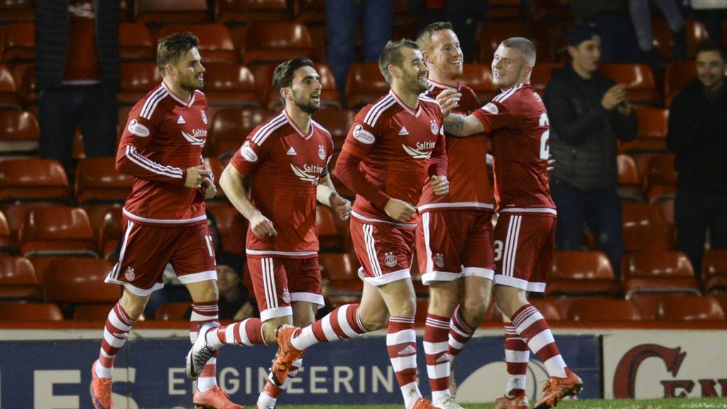 Adam Rooney scored the opening goal (second right)