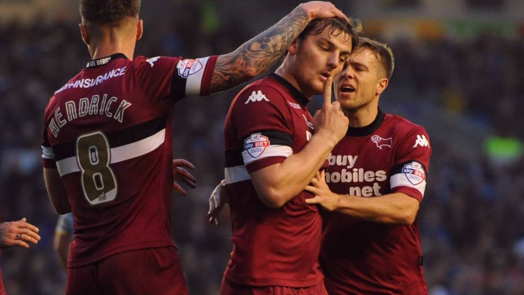 Chris Martin celebrates after scoring Derby's penalty