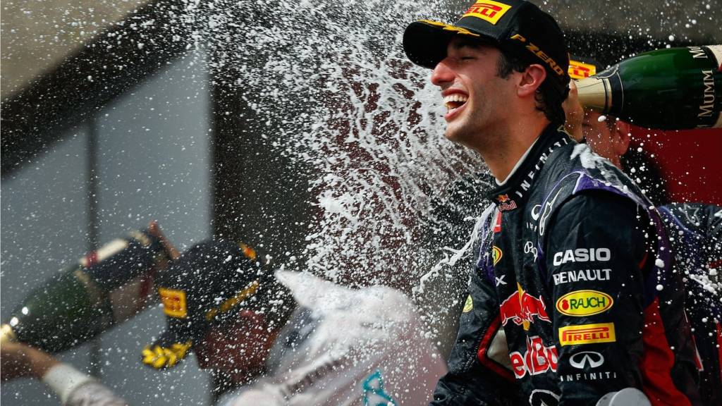 Racewinner Daniel Ricciardo of Australia and Infiniti Red Bull Racing is sprayed with champagne by teammate Sebastian Vettel of Germany