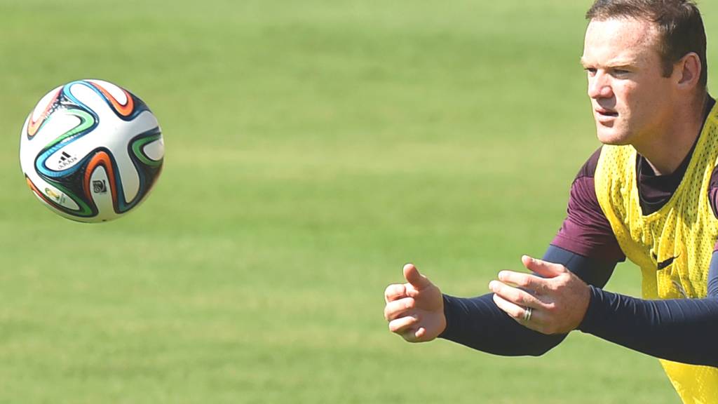 Wayne Rooney catches the ball in England training ahead of his side's game against Italy in the 2014 Fifa World Cup