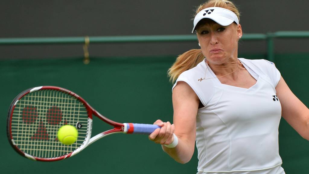Britain's Elena Baltacha returns against Italy's Flavia Pennetta
