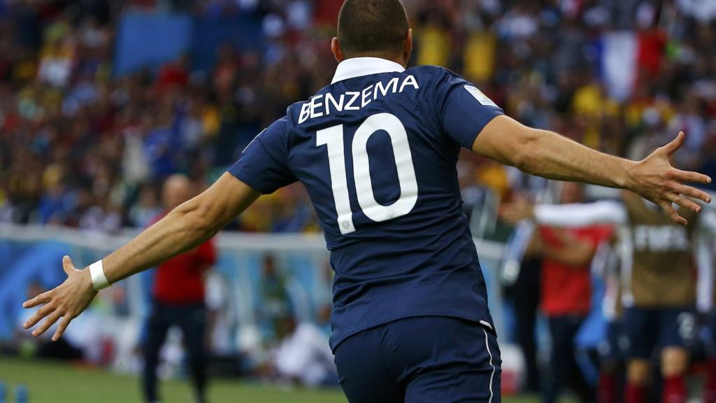 Karim Benzema celebrates after scoring France's third goal of the evening