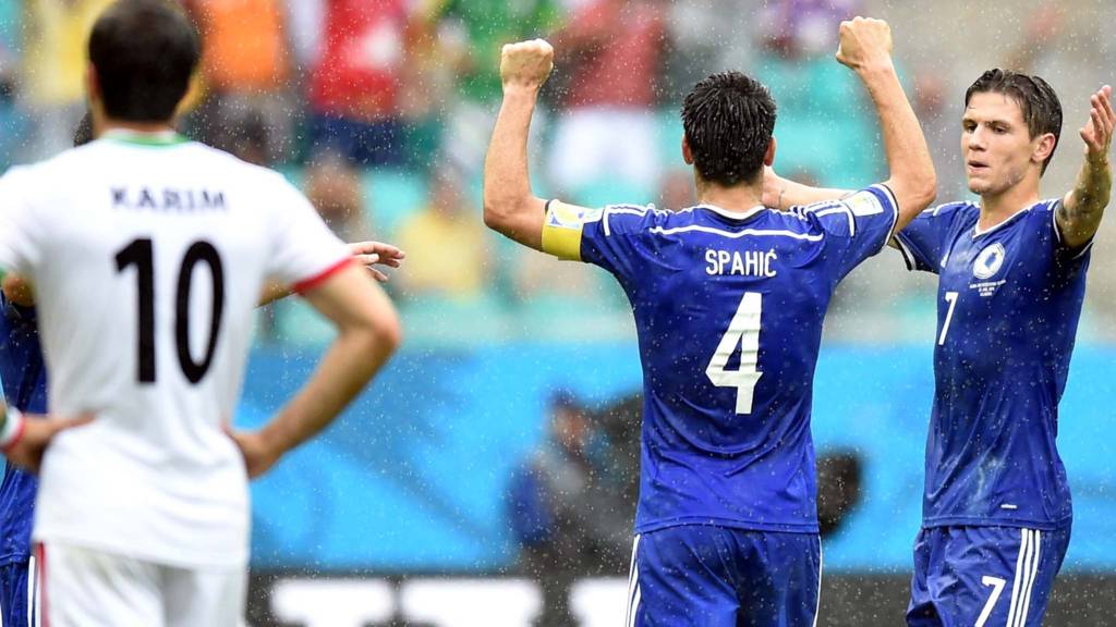 Bosnia-Herzegovina's defender Emir Spahic and Bosnia-Herzegovina's midfielder Muhamed Besic celebrate