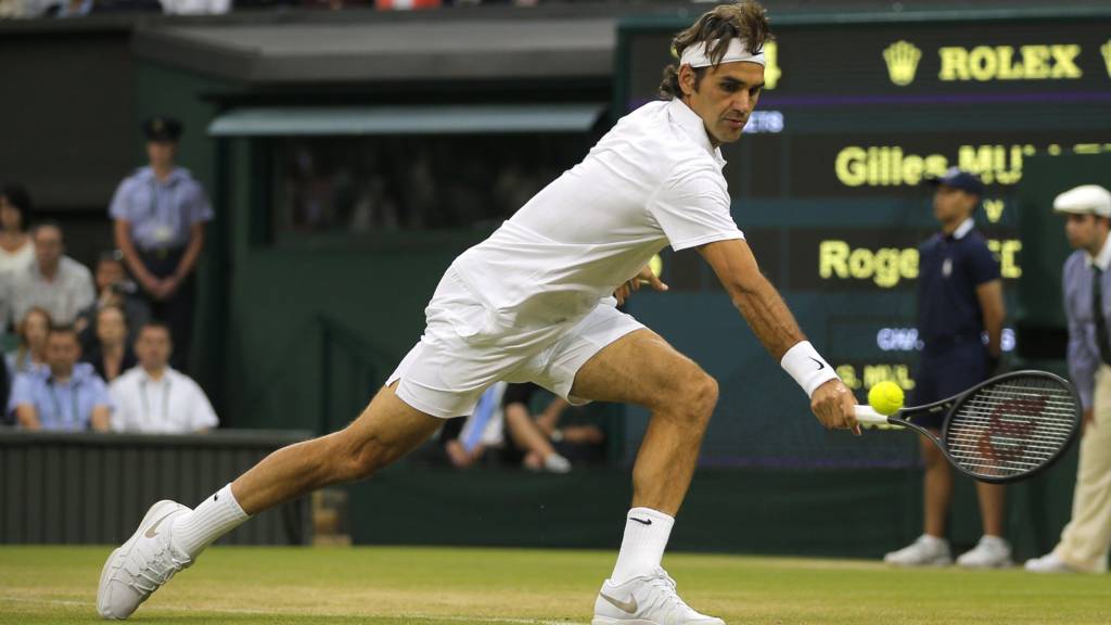 Roger Federer of Switzerland plays a return