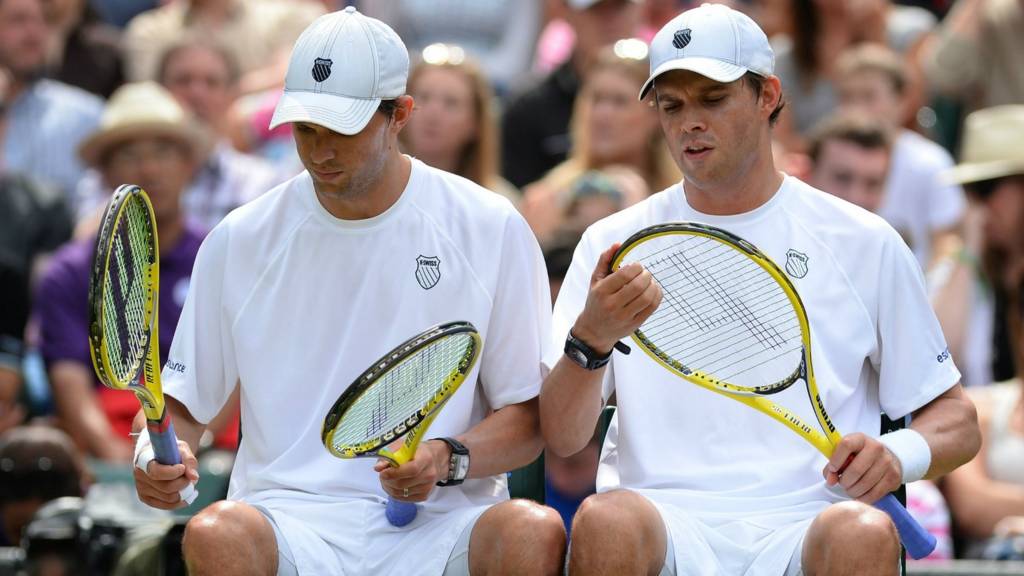 Bryan brothers in action at Wimbledon 2014