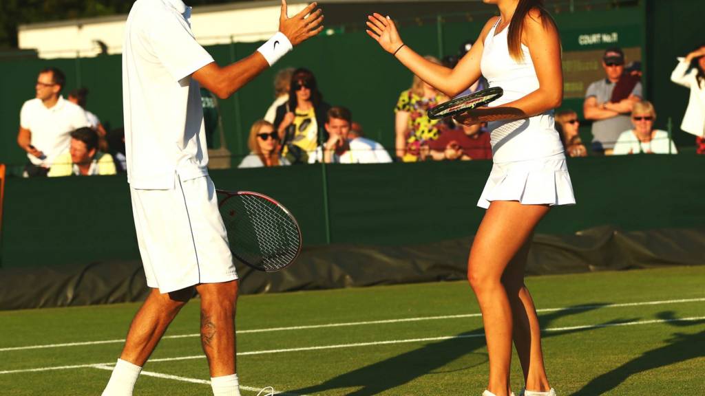 Mixed doubles partners in action at Wimbledon 2014