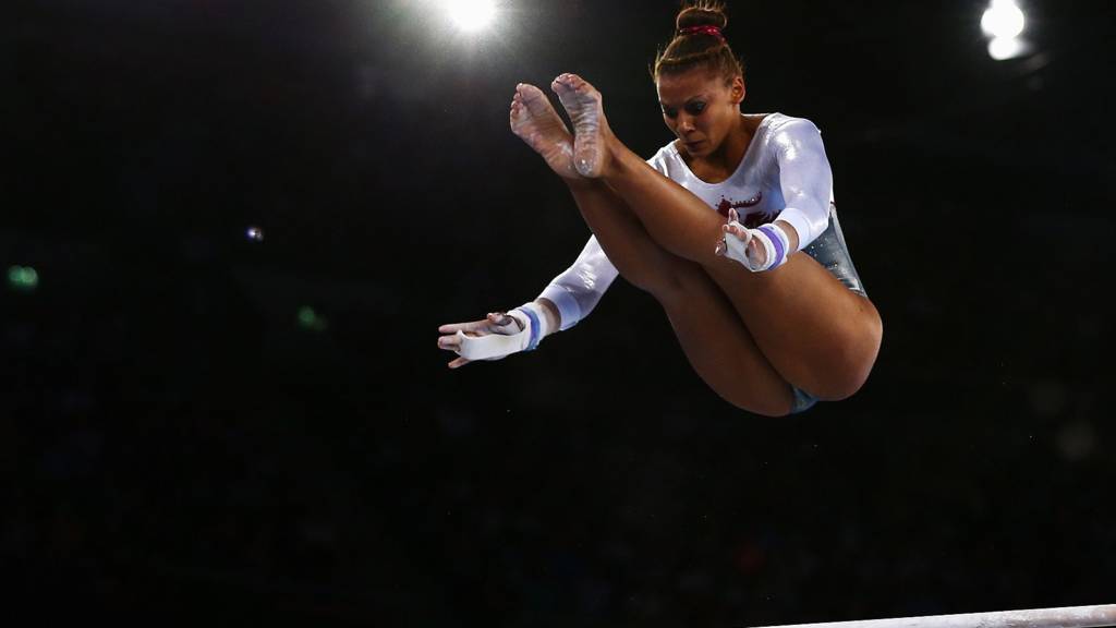 Rebecca Downey of England on the horizontal bars
