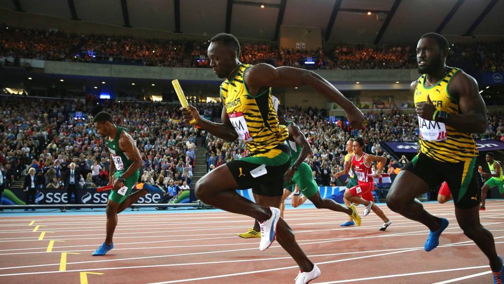 Usain Bolt competes in the Men"s 4x100 metres relay