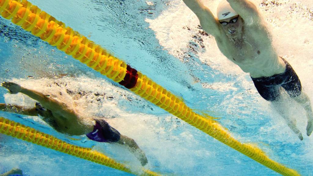 Taken underwater shows Great Britain Adam Peaty and Italy Mattia Pesce competing in the 50m breaststroke