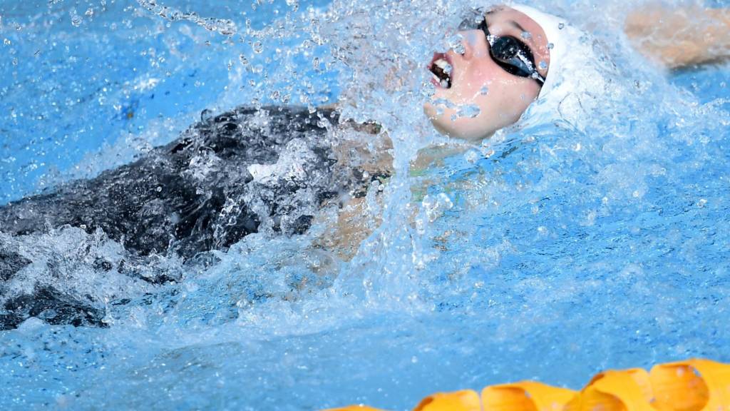 Georgia Davies competes in 50m backstroke