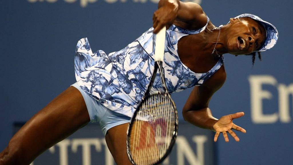 Venus Williams serves at the 2014 US Open