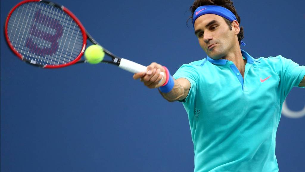 Roger Federer of Switzerland returns a shot