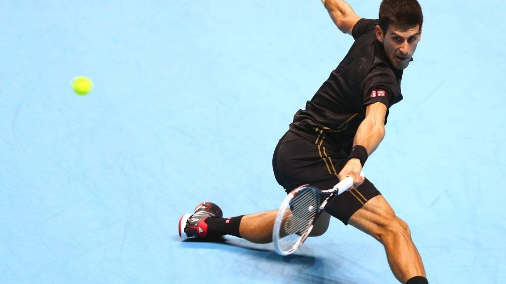 Novak Djokovic hits a backhand