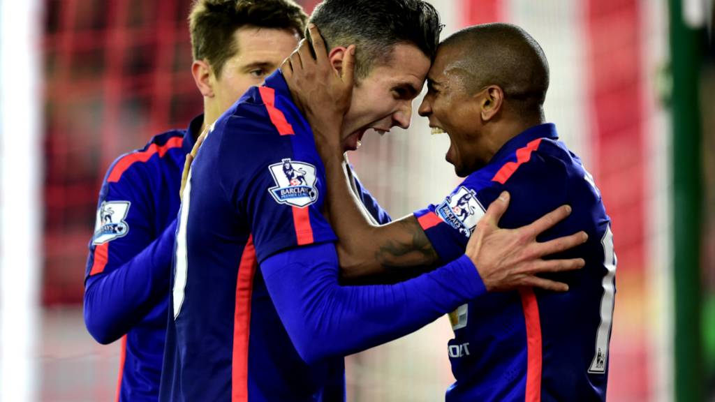 Robin van Persie and Ashley Young celebrate