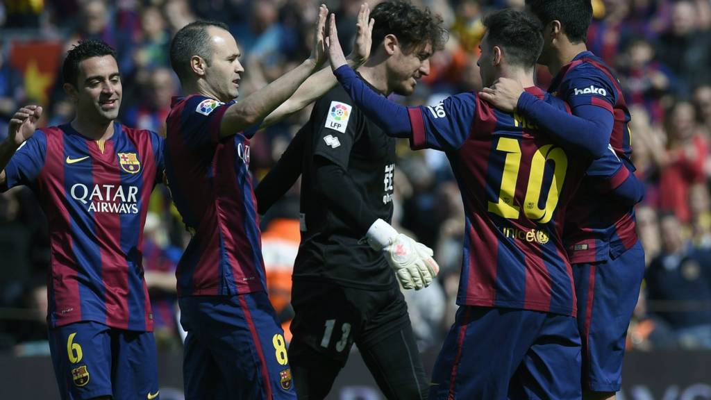 Messi celebrates with Barcelona teammates