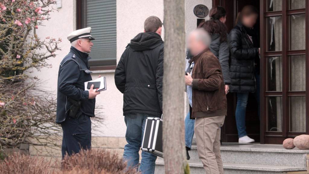 Police officers search a house in Montabaur in the aftermath of Germanwings plane crash