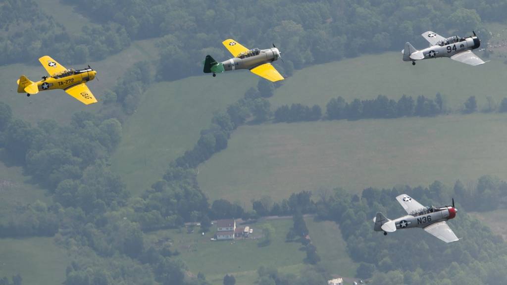 World War II era trainer aircraft practice formation flying over Culpeper Regional Airport in Brandy Station, Virginia, May 7, 2015.