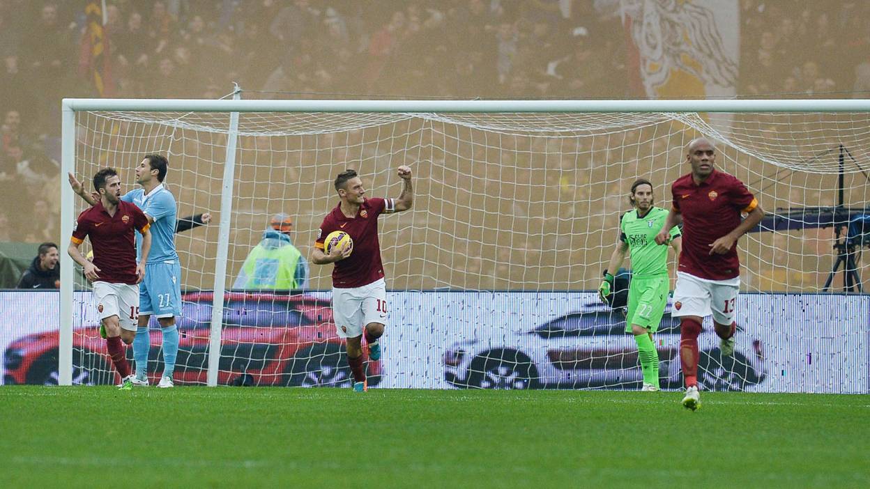Roma legend Francesco Totti celebrates scoring against rivals Lazio