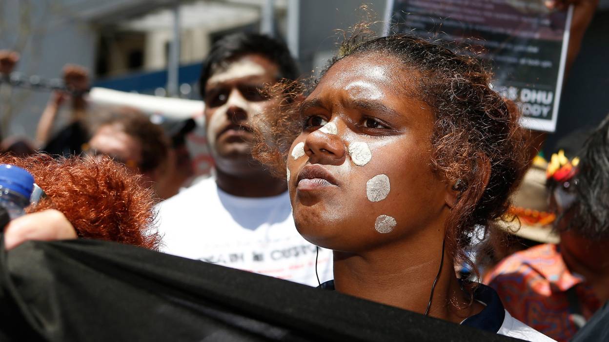 A woman attends a march to protest for aboriginal rights.