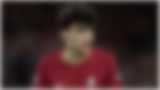 A blurred image of a footballer