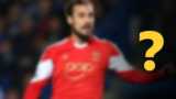 A blurred image of a footballer