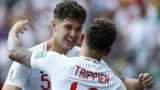 England's John Stones celebrates scoring by preparing to hug Kieran Trippier