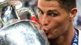 Cristiano Ronaldo kisses the trophy