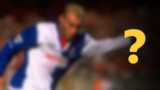 A blurred image of a footballer